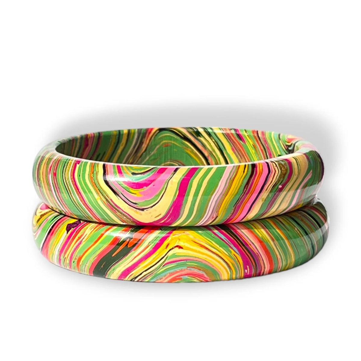 Two stacked bangles with a vibrant, multicolored swirl pattern of pink, green, yellow, orange, and black on a white background.